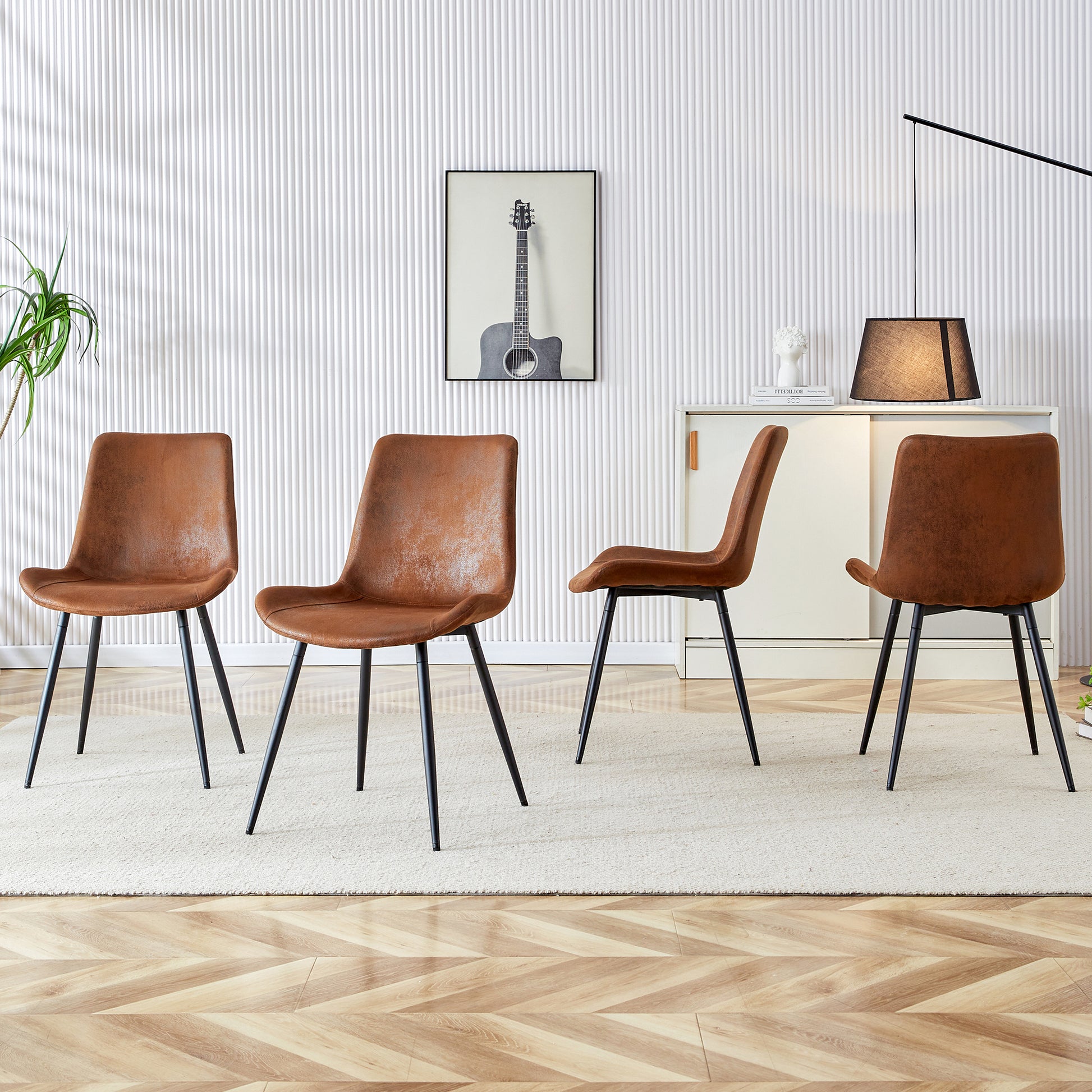 Brown faux leather dining chairs with black metal legs