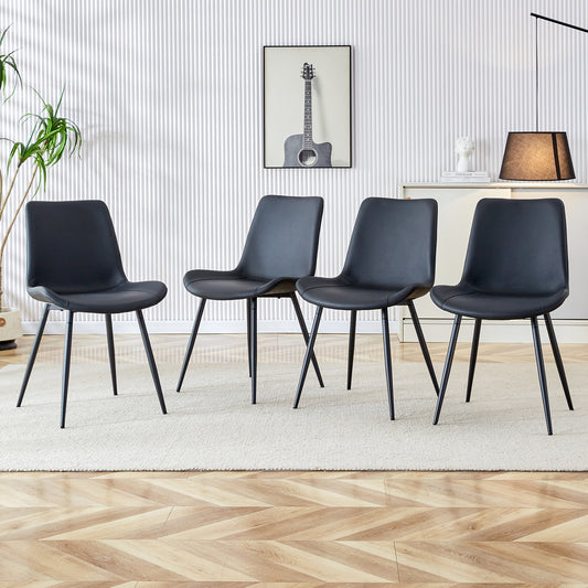 Set of four black faux leather dining chairs with metal legs