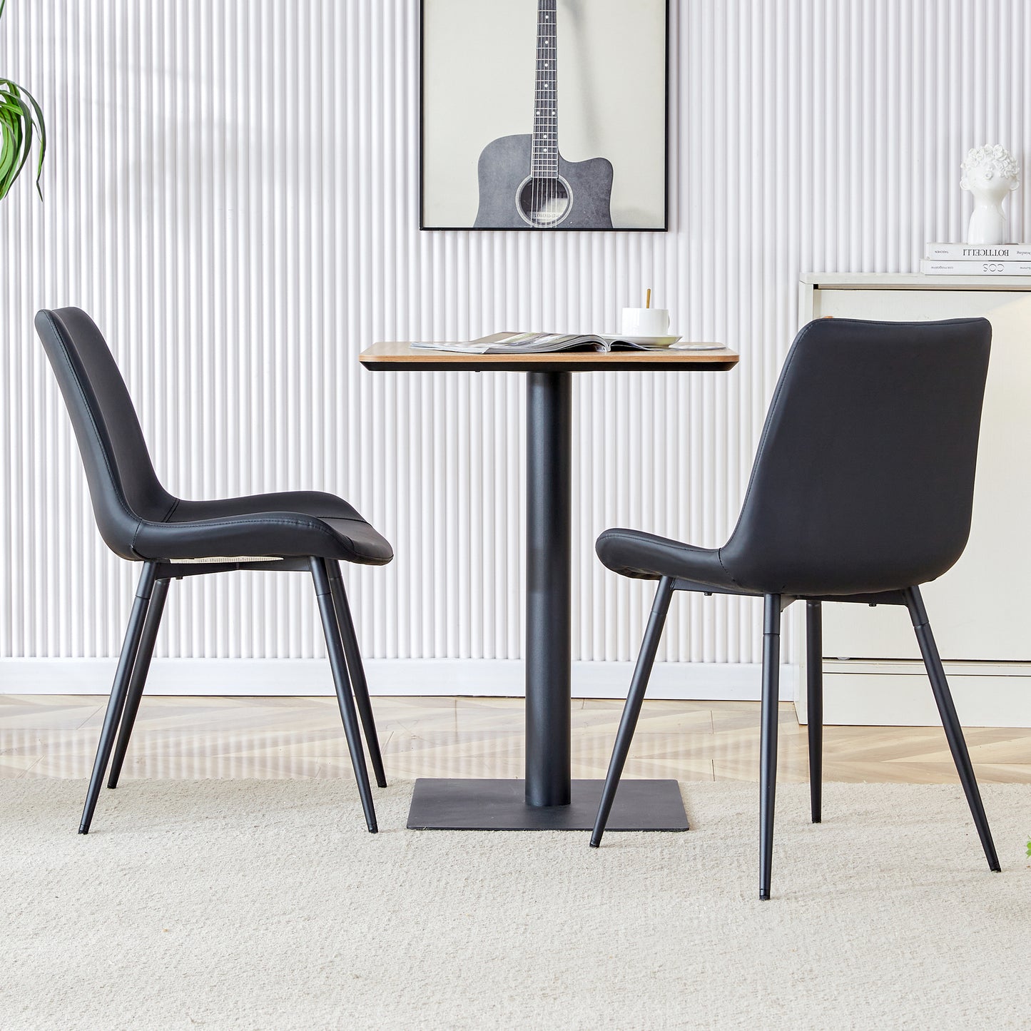 Black faux leather dining chair with metal legs