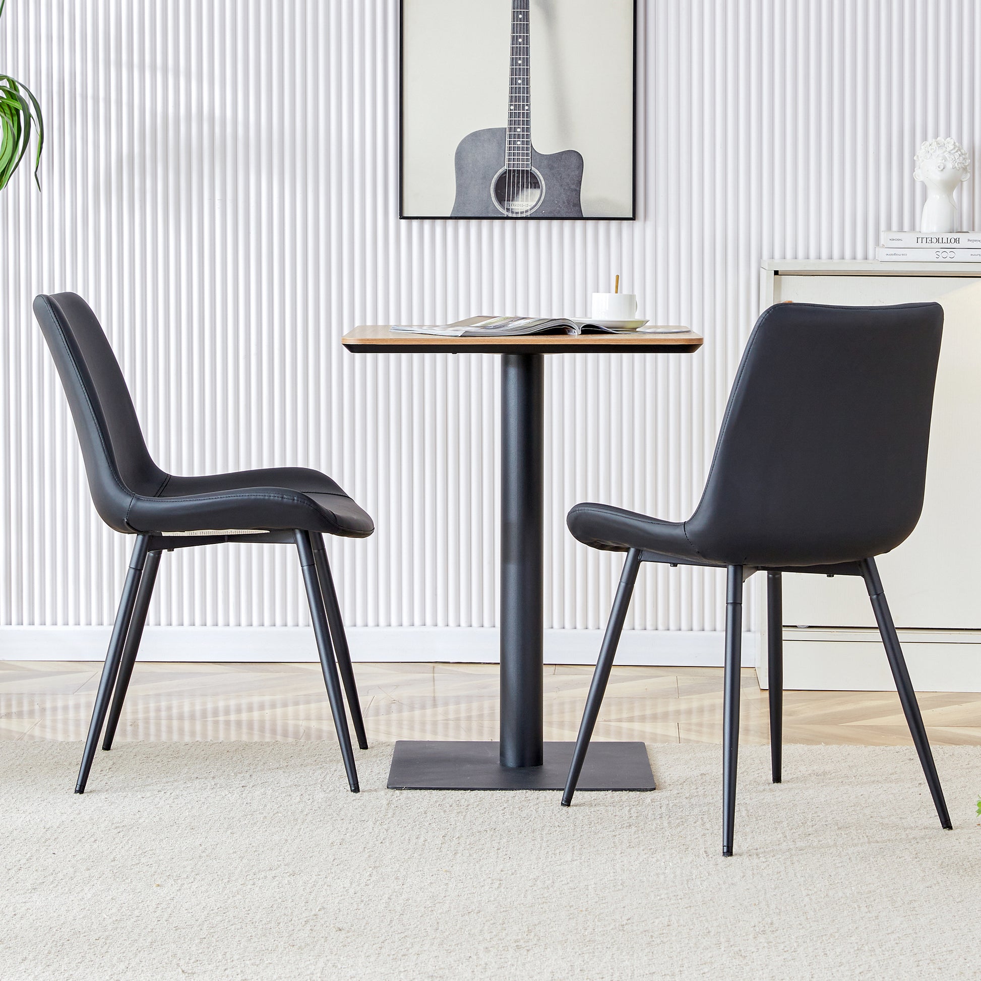 Black faux leather dining chair with metal legs