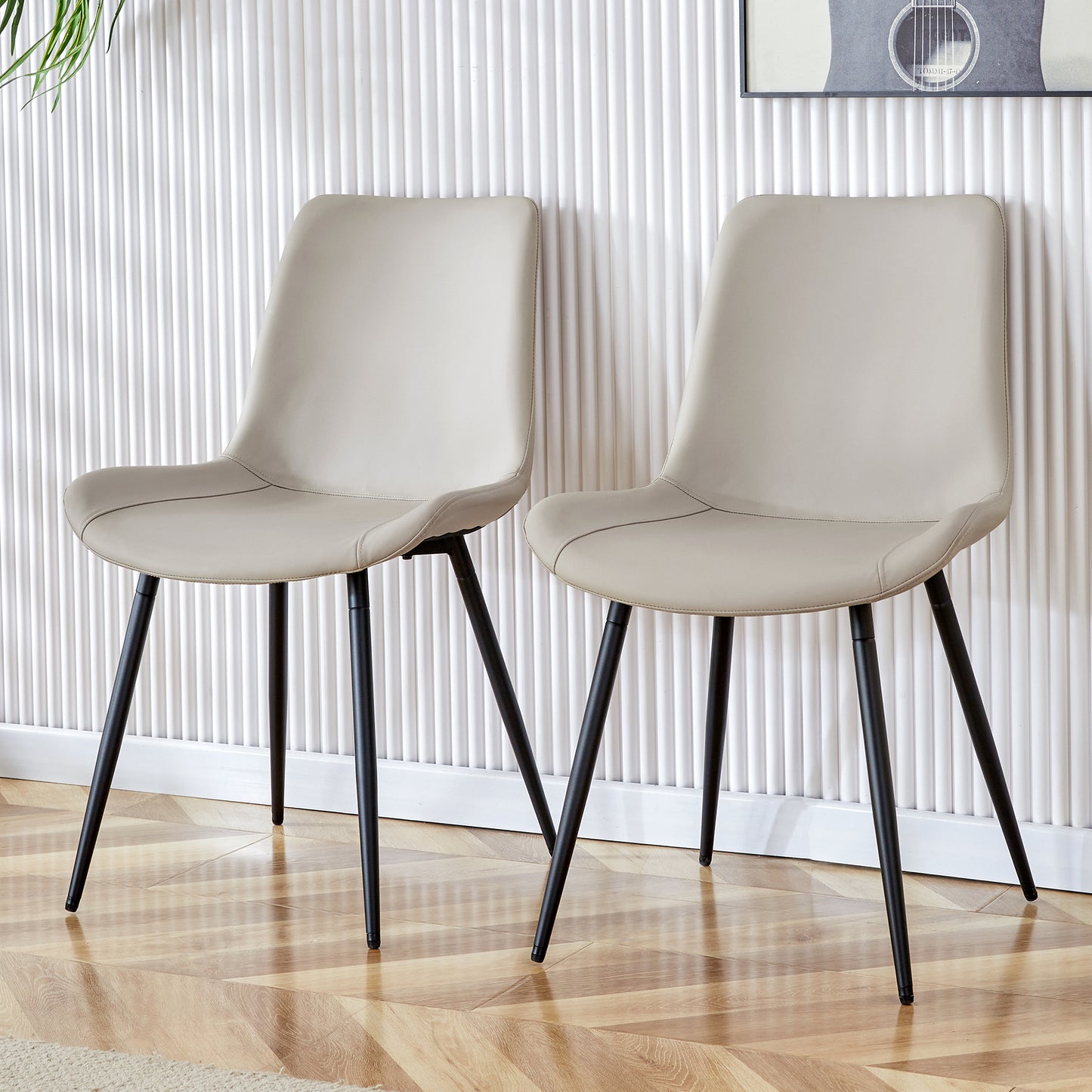 Beige faux leather dining chair with black metal legs