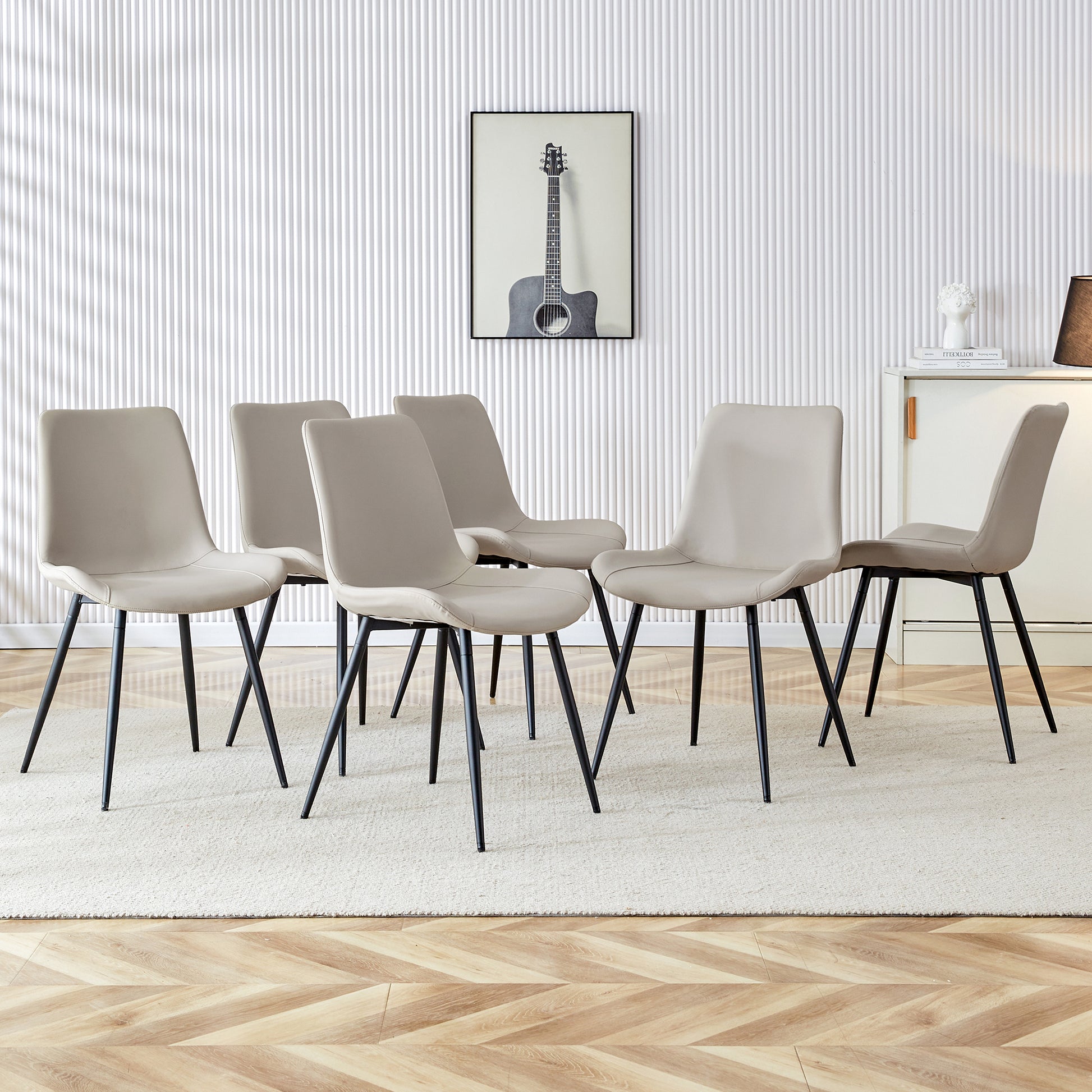Set of six beige dining chairs with black metal legs