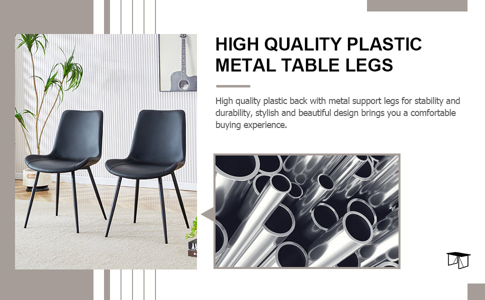 Two black faux leather dining chairs with slender metal legs
