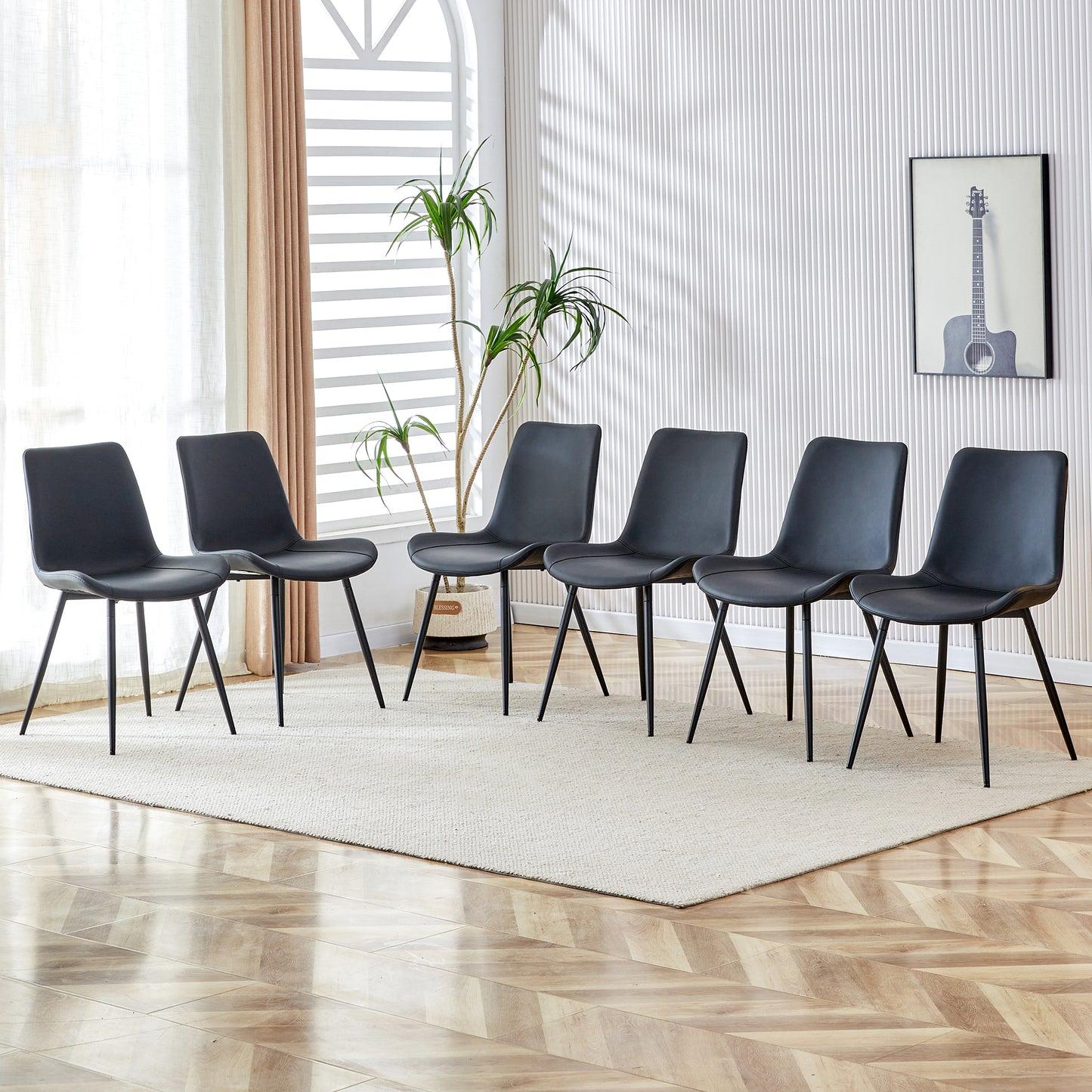 Set of  black modern dining chairs with slender metal legs