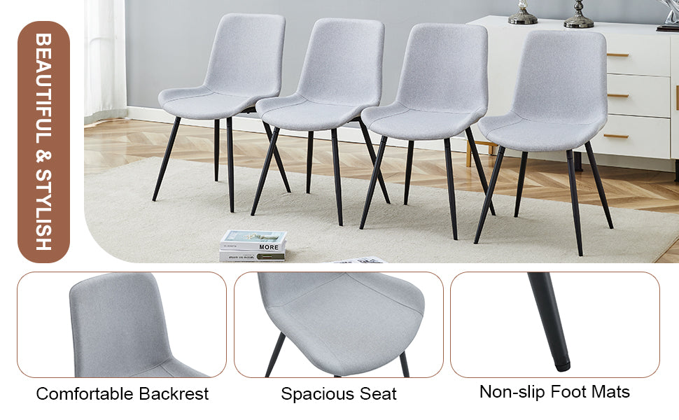 Four light gray fabric dining chairs with black metal legs perfect for modern kitchens