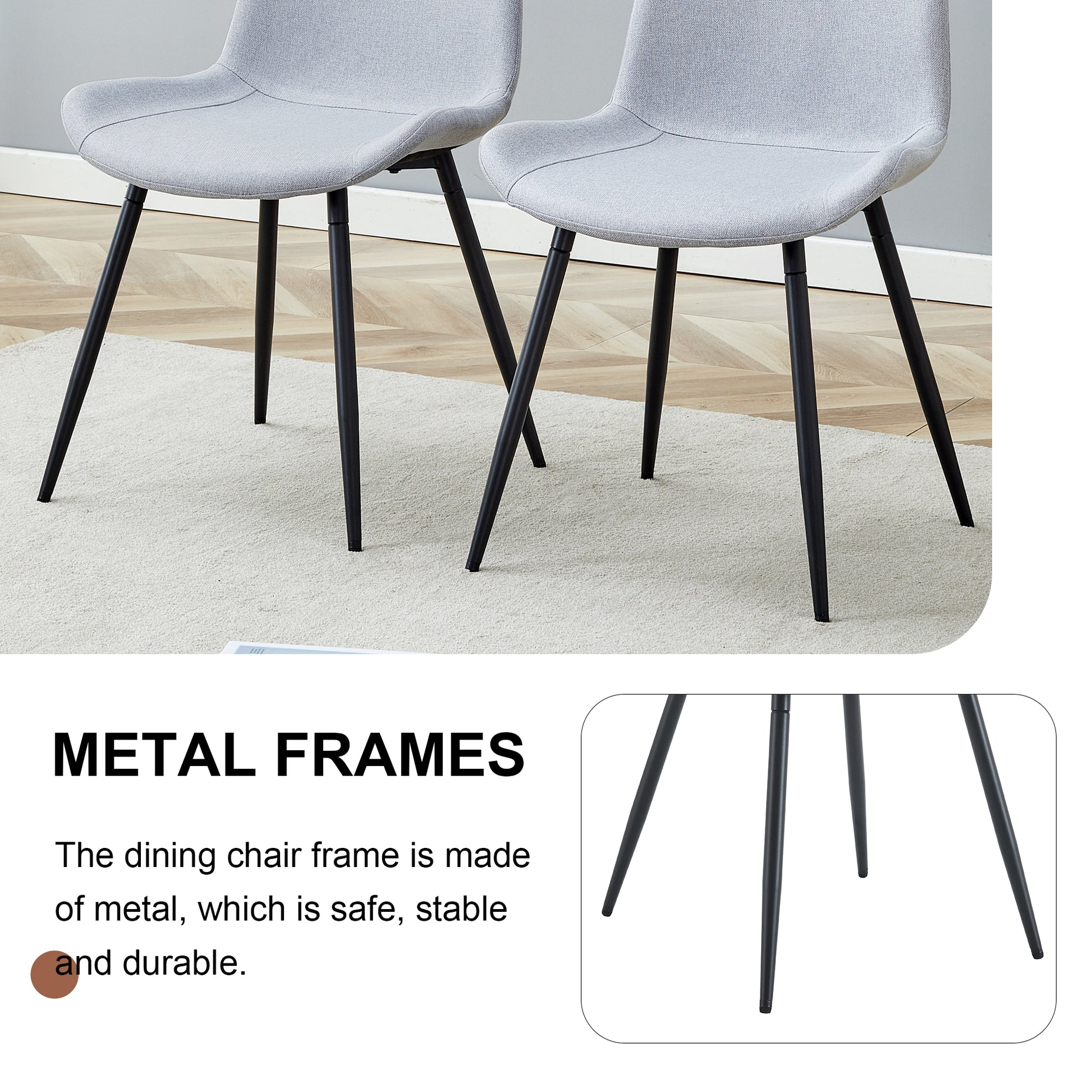 Two light grey fabric dining chairs with black metal legs