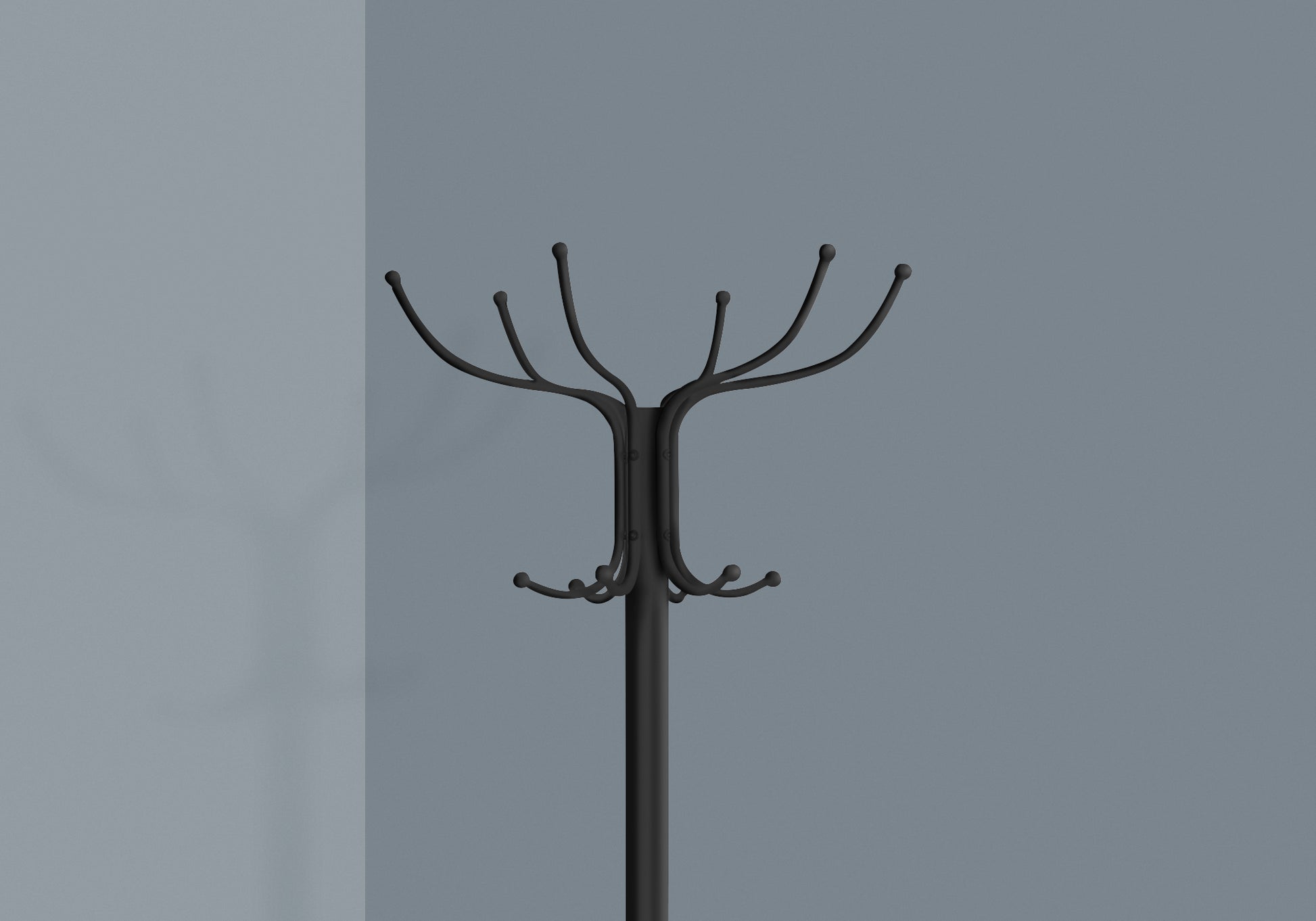 Black metal coat rack with multiple branches and hooks