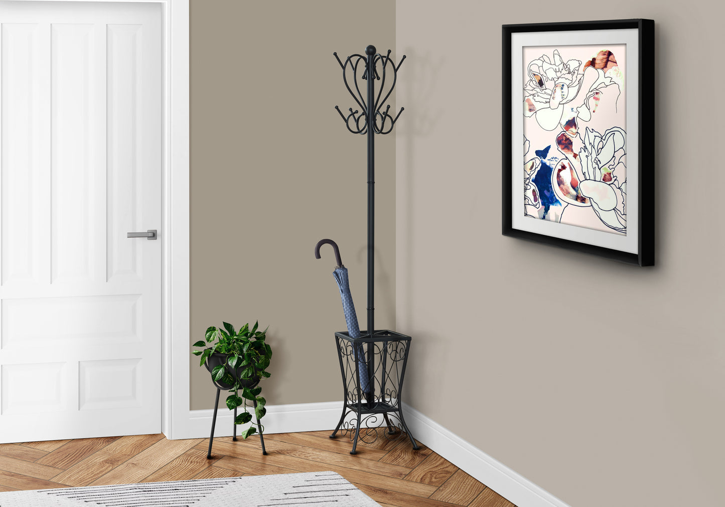 Black ornate coat rack with decorative scrollwork and hooks