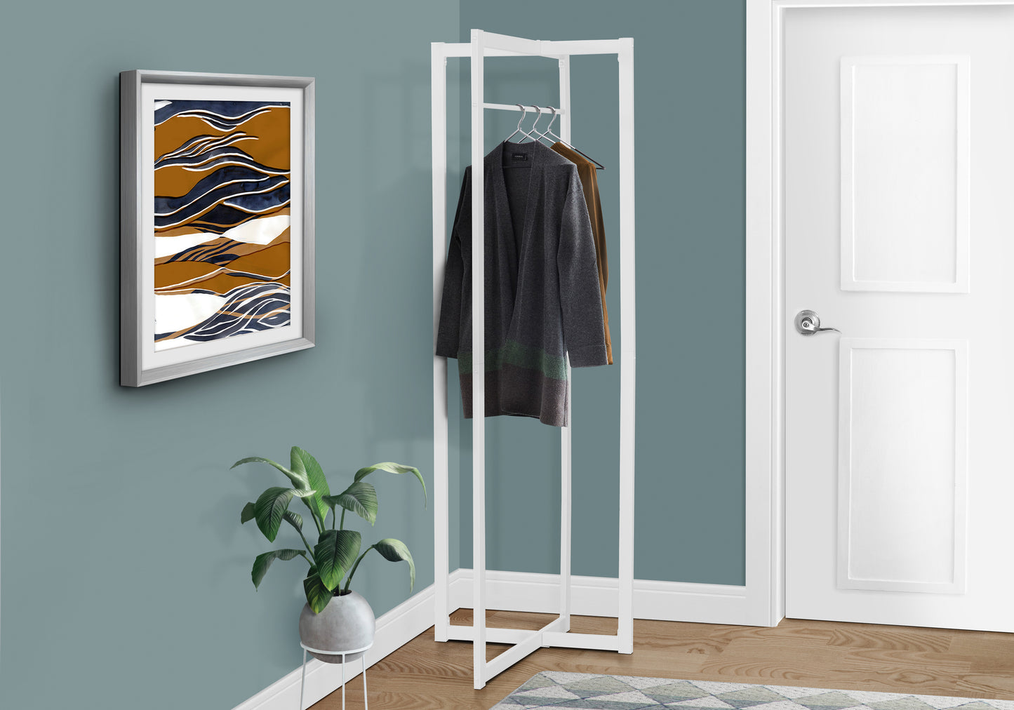 Modern white metal coat rack with two jackets