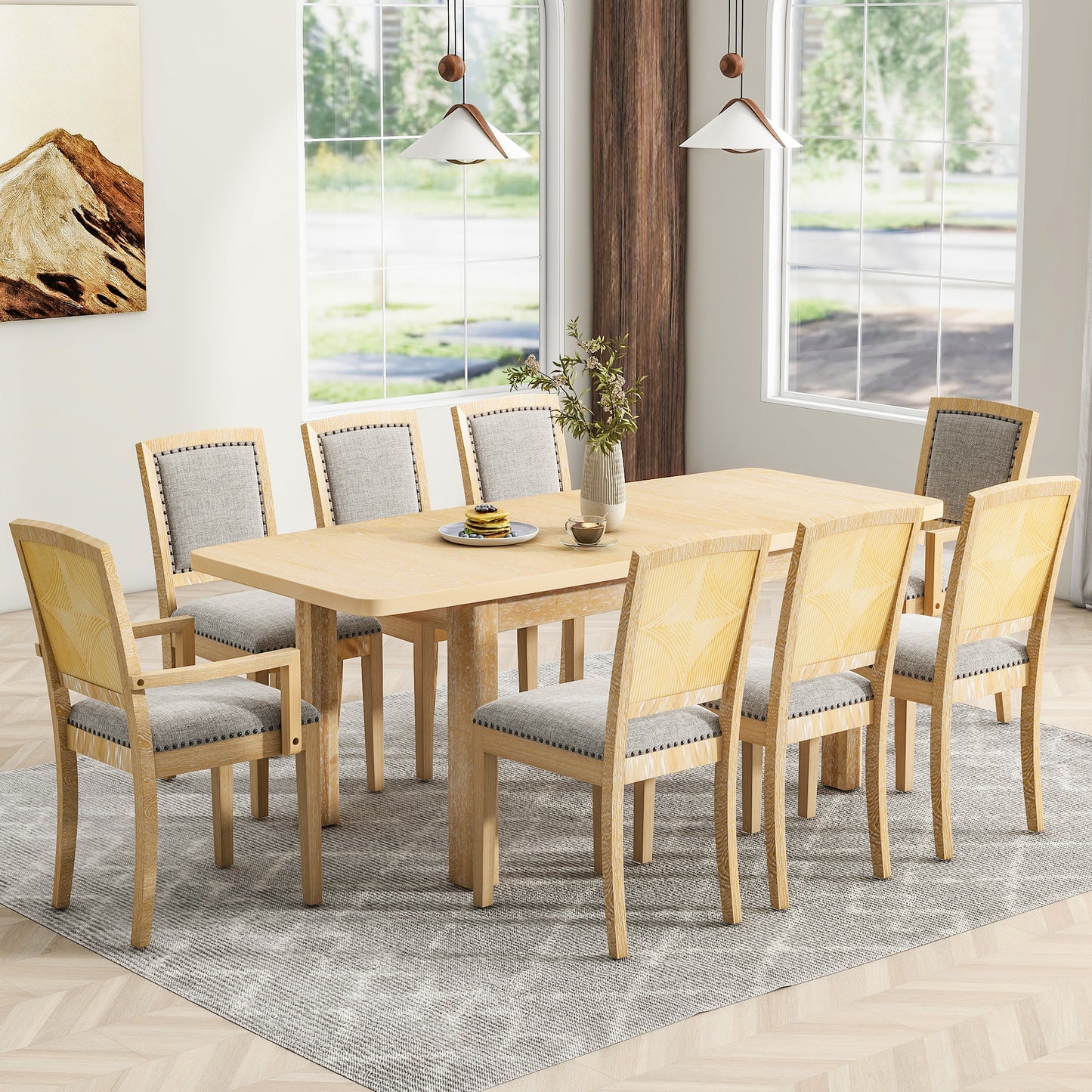 Light oak dining table with gray upholstered chairs and woven backrests
