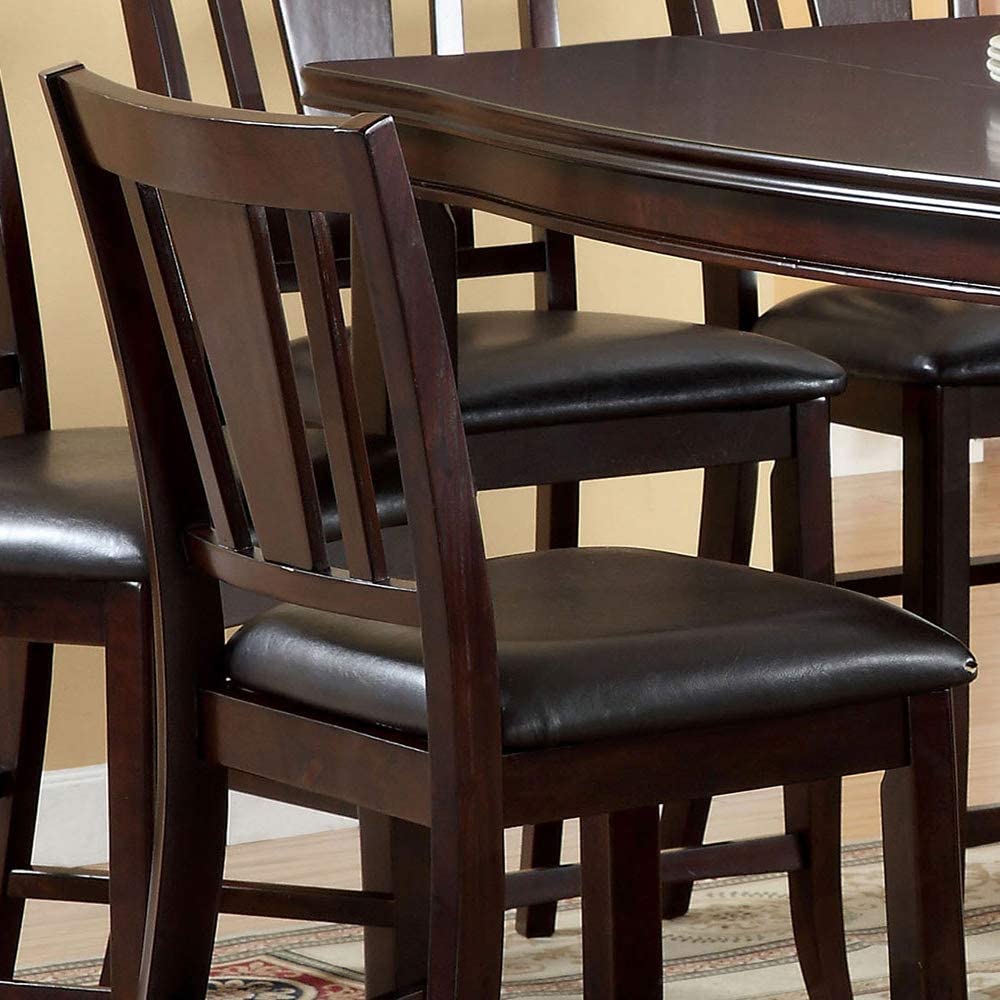 Dark wood dining chairs with black leather seats