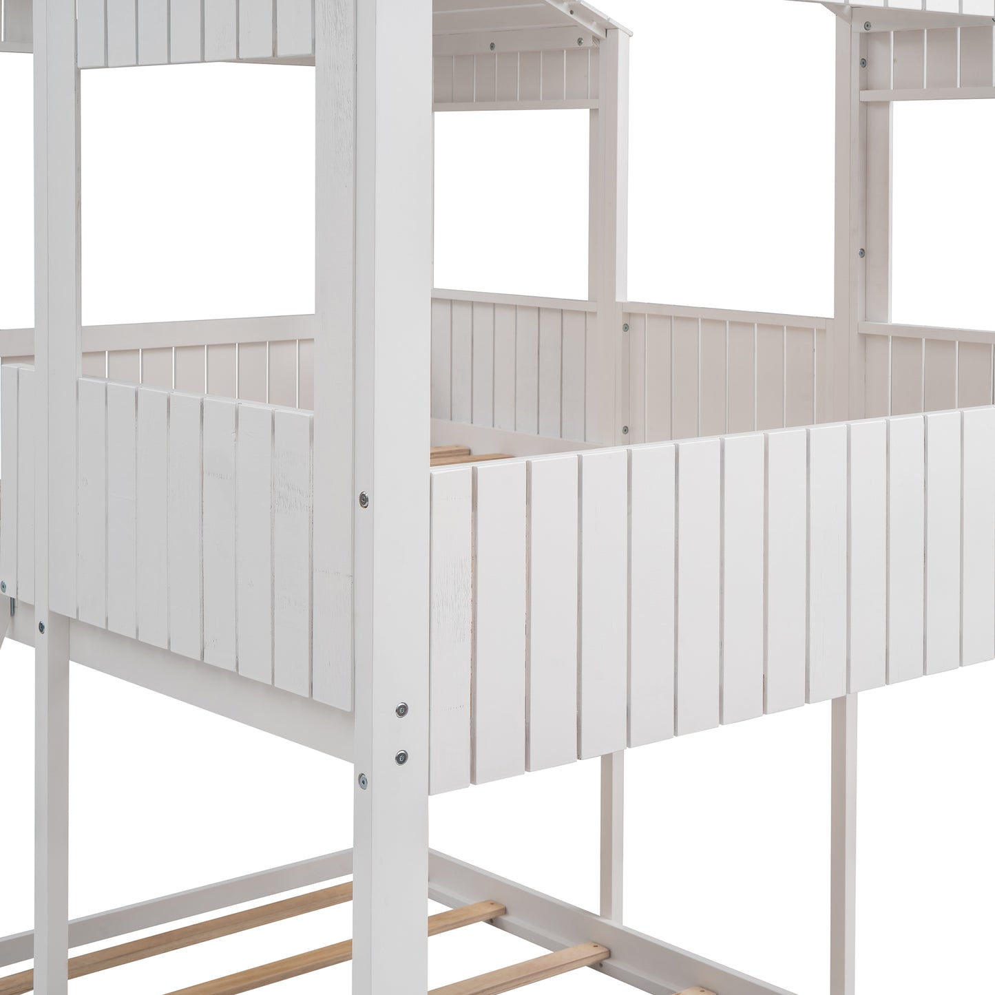 White wooden toddler bed with slatted railing detail