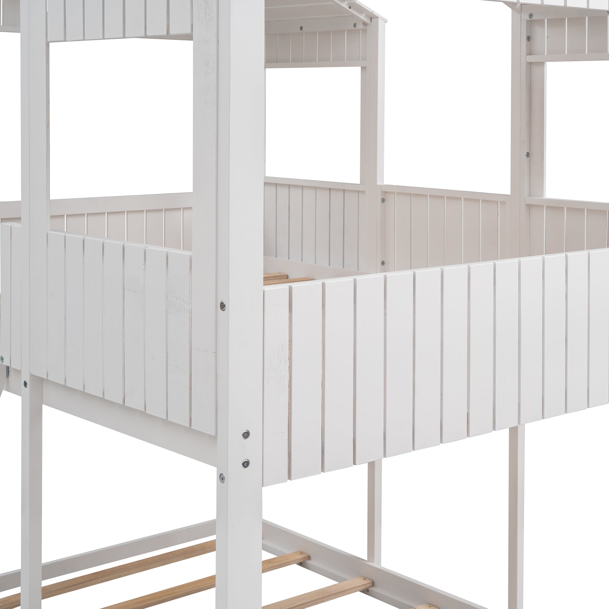 White wooden toddler bed with slatted railing detail