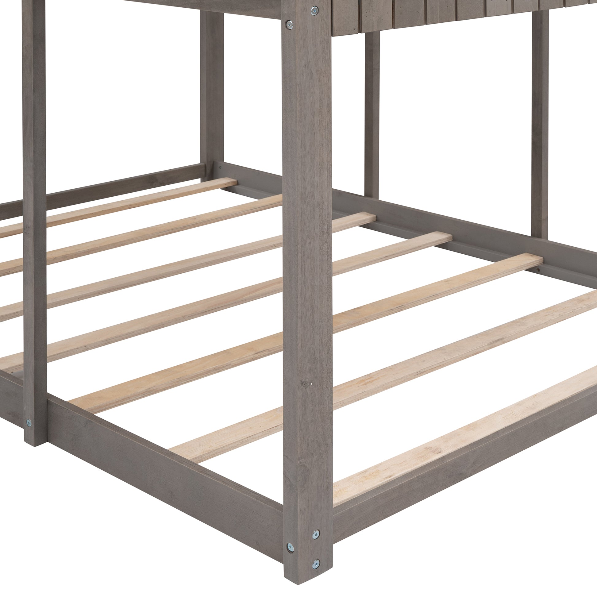 Closeup of grey wooden bunk bed frame with slatted base