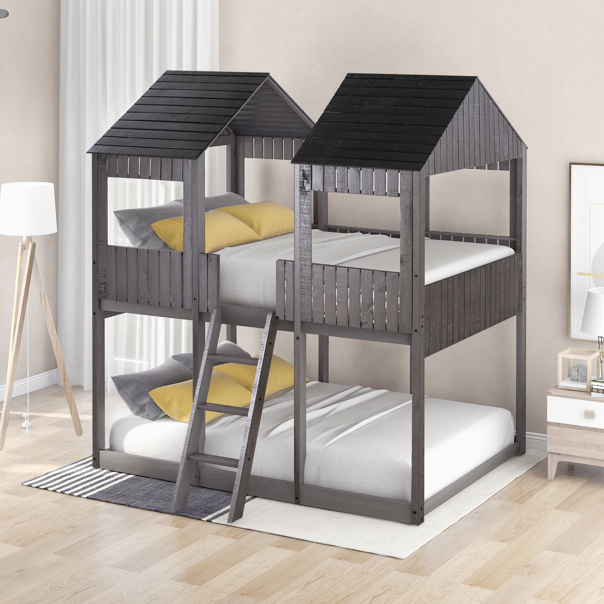 Gray wooden house bunk bed with ladder and yellow accent pillows