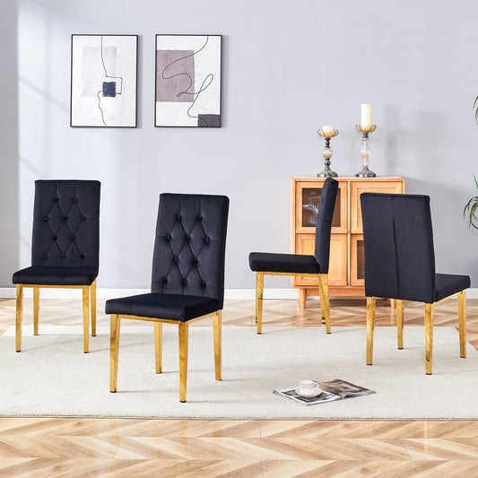 Black velvet dining chairs with tufted backs and gold legs