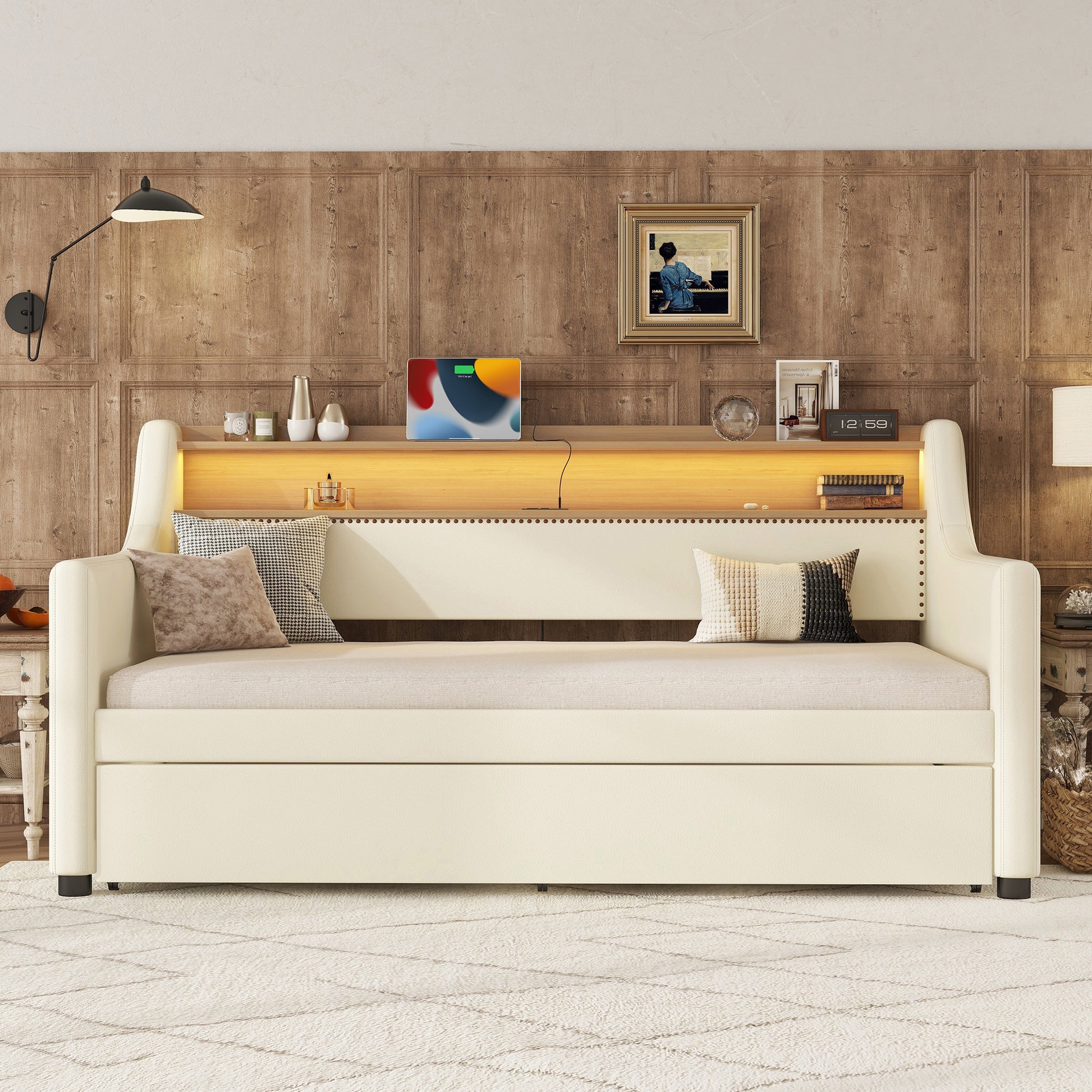Cream upholstered daybed with builtin shelving and LED lighting