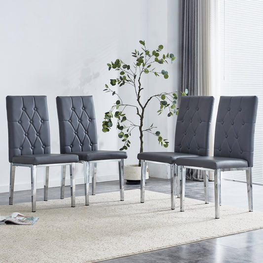 Four dark grey faux leather dining chairs with tufted backs and chrome legs